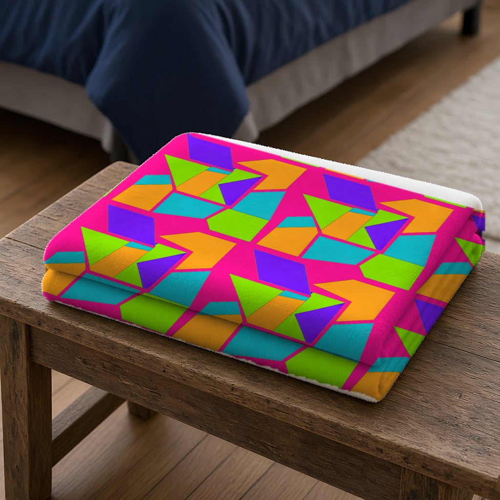 Cubist Block Quilt Sherpa Fleece Blanket folded on a wooden bench