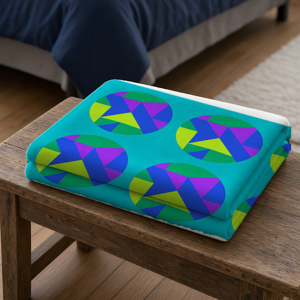 Broken Circle Planes Sherpa Fleece Blanket folded on a wooden bench