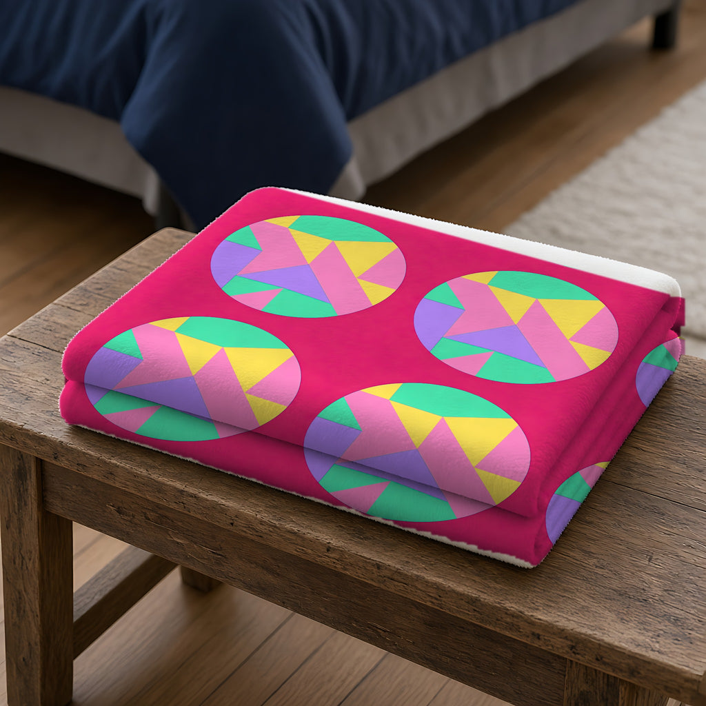 Broken Circle Planes Sherpa Fleece Blanket folded on a wooden bench