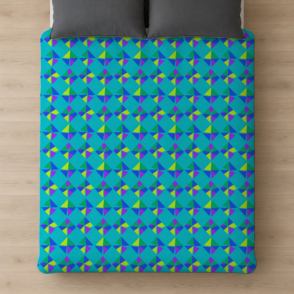 Stacked Cubist Prisms Comforter on a bed, seen from above