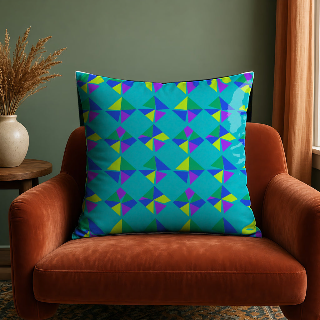 Stacked Cubist Prisms Faux Suede Cushion in the Peacock Jewel palette, on a rust velvet armchair against a sage wall