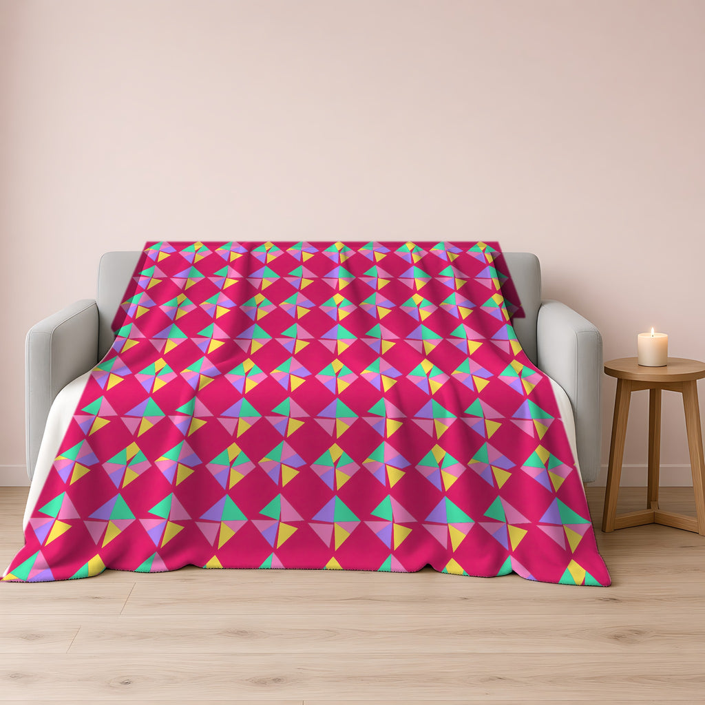Stacked Cubist Prisms Sherpa Fleece Blanket draped over a grey sofa