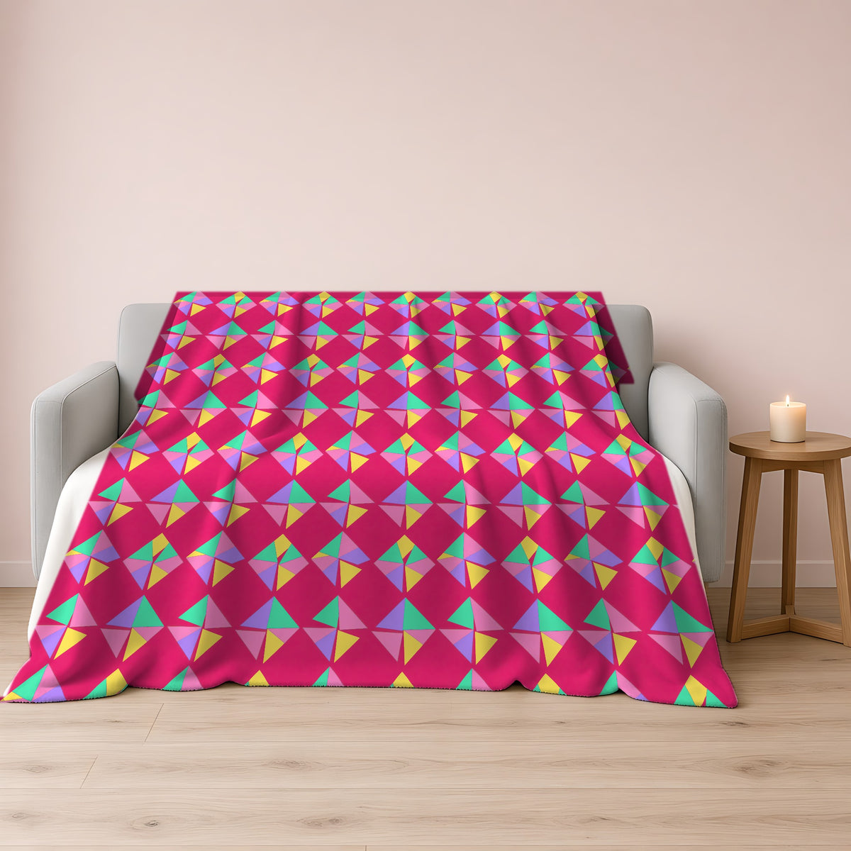 Stacked Cubist Prisms Sherpa Fleece Blanket draped over a grey sofa
