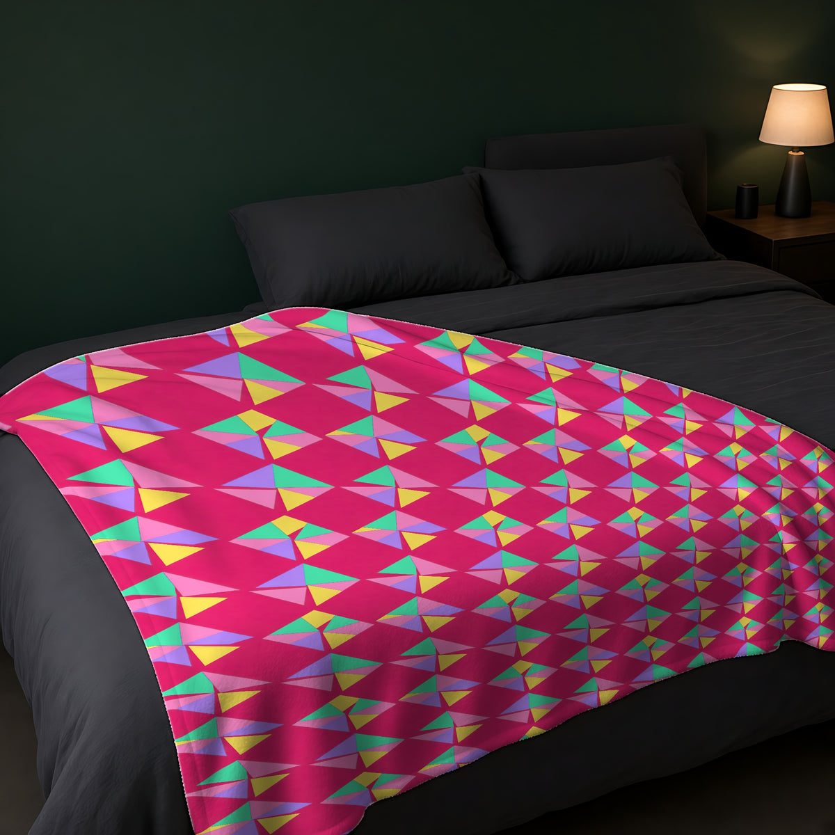 Stacked Cubist Prisms Sherpa Fleece Blanket across the foot of a dark bed