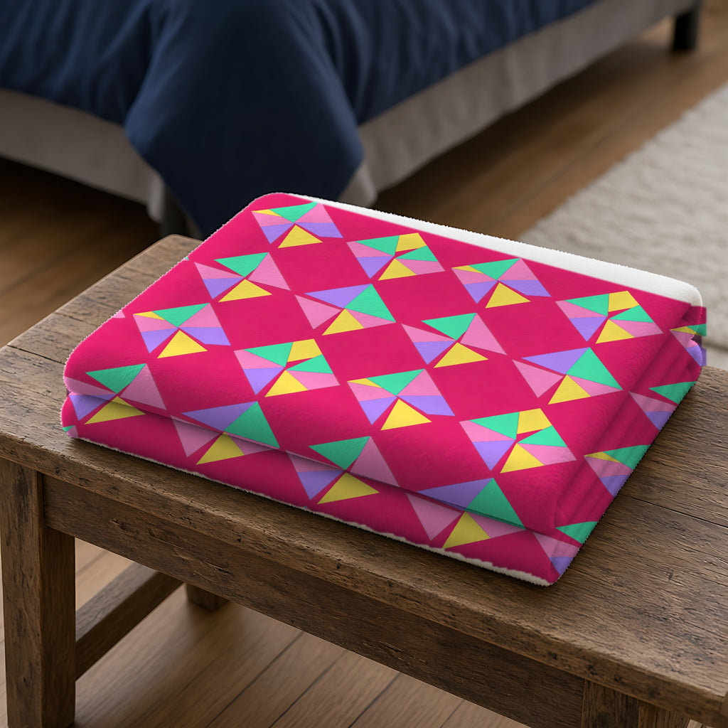 Stacked Cubist Prisms Sherpa Fleece Blanket folded on a wooden bench