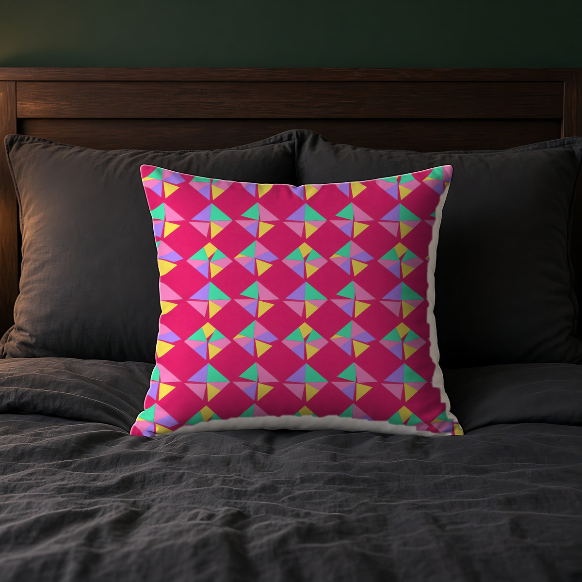 Stacked Cubist Prisms Faux Suede Cushion on a bed with charcoal bedding