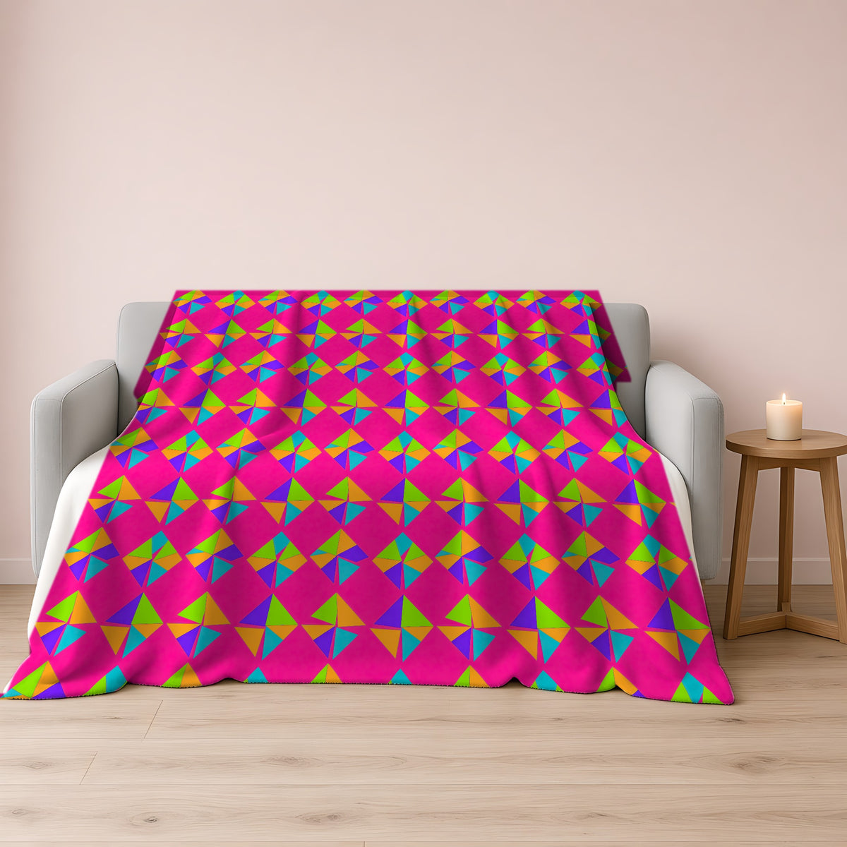 Stacked Cubist Prisms Sherpa Fleece Blanket draped over a grey sofa