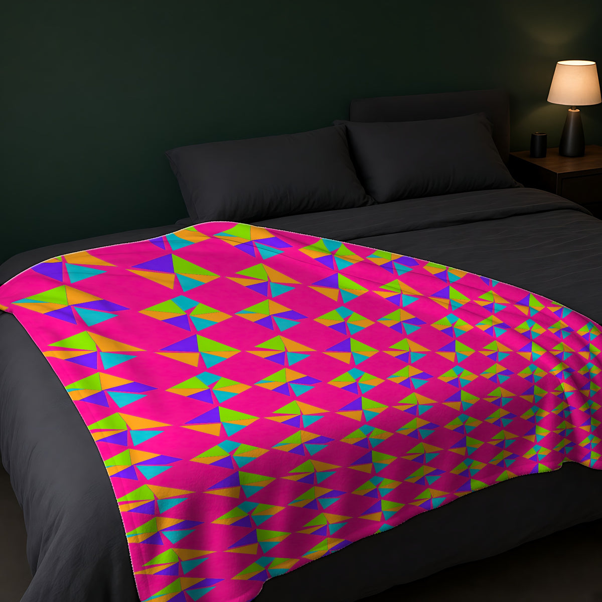 Stacked Cubist Prisms Sherpa Fleece Blanket across the foot of a dark bed