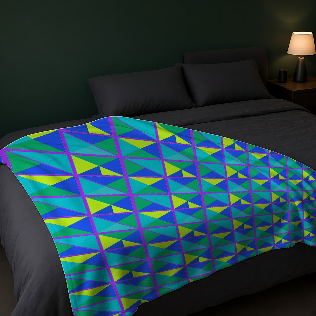 Split Square Fiesta Sherpa Fleece Blanket across the foot of a dark bed