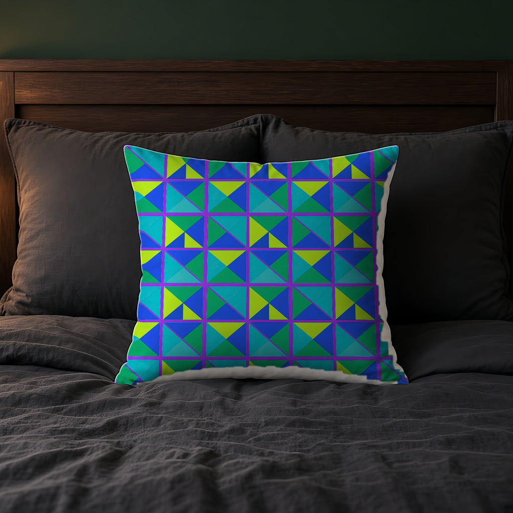 Split Square Fiesta Faux Suede Cushion on a bed with charcoal bedding