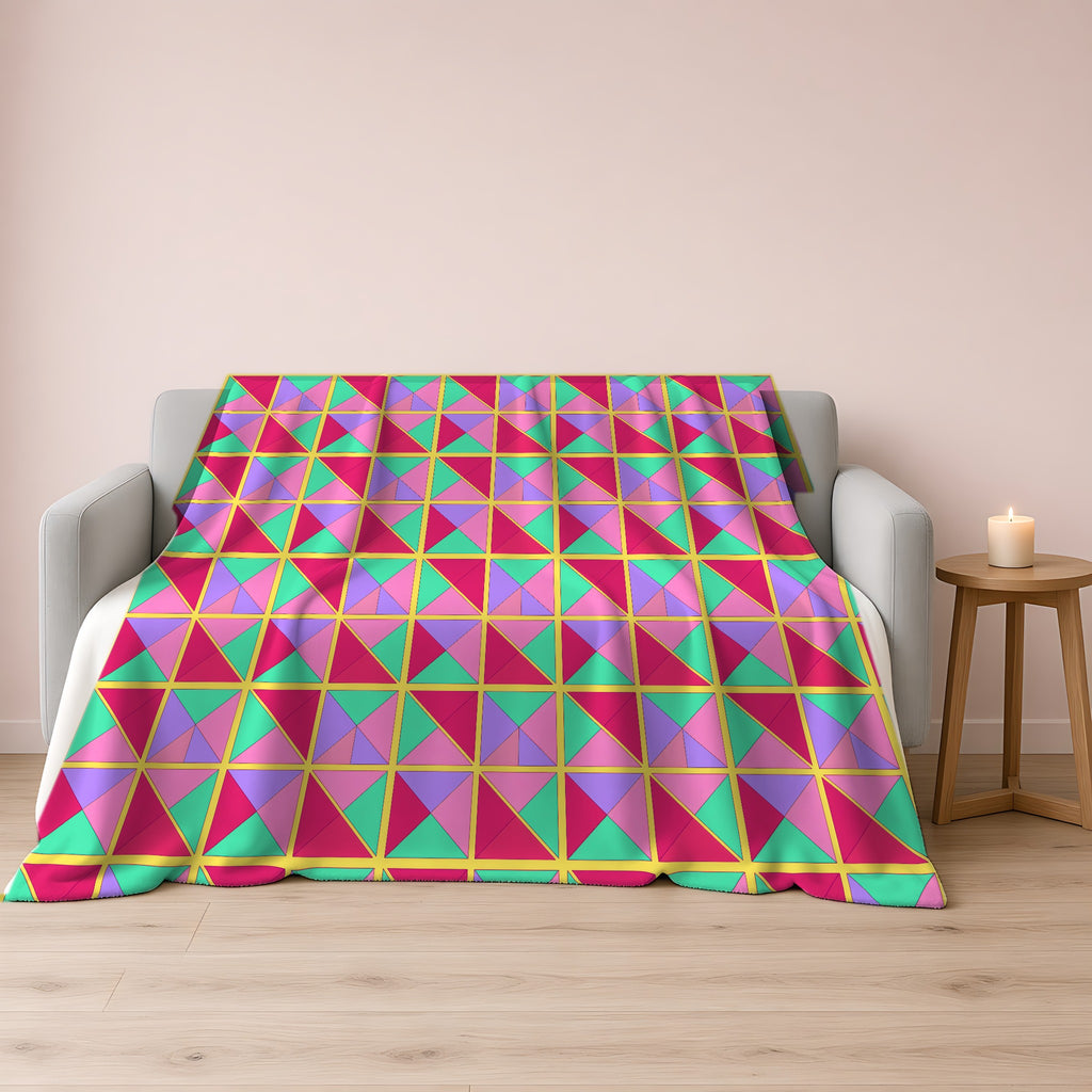 Split Square Fiesta Sherpa Fleece Blanket draped over a grey sofa