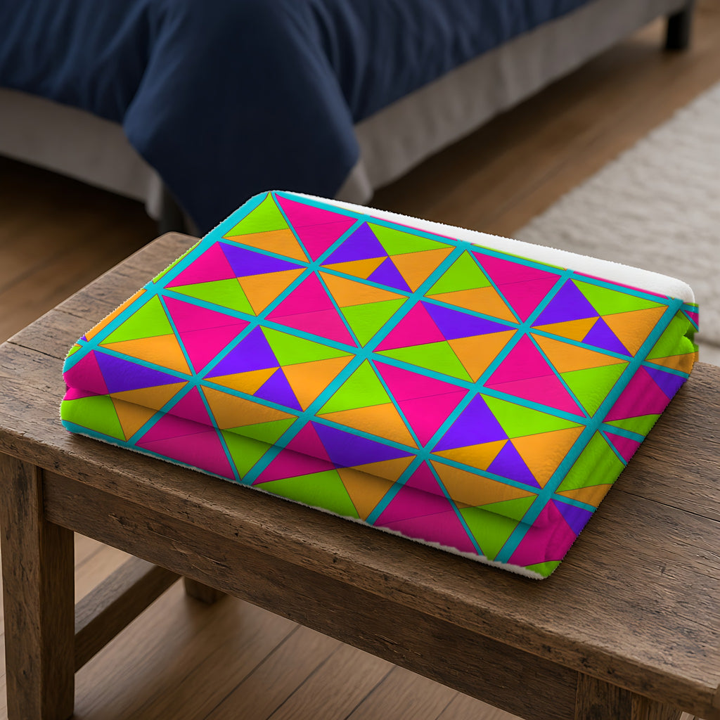 Split Square Fiesta Sherpa Fleece Blanket folded on a wooden bench