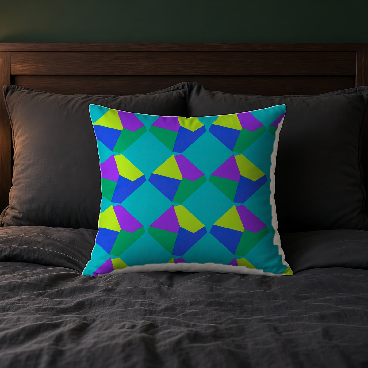 Grand Fractured Rhombus Faux Suede Cushion on a bed with charcoal bedding