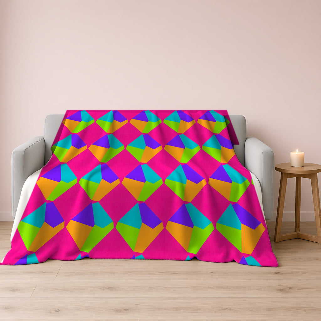 Grand Fractured Rhombus Sherpa Fleece Blanket draped over a grey sofa