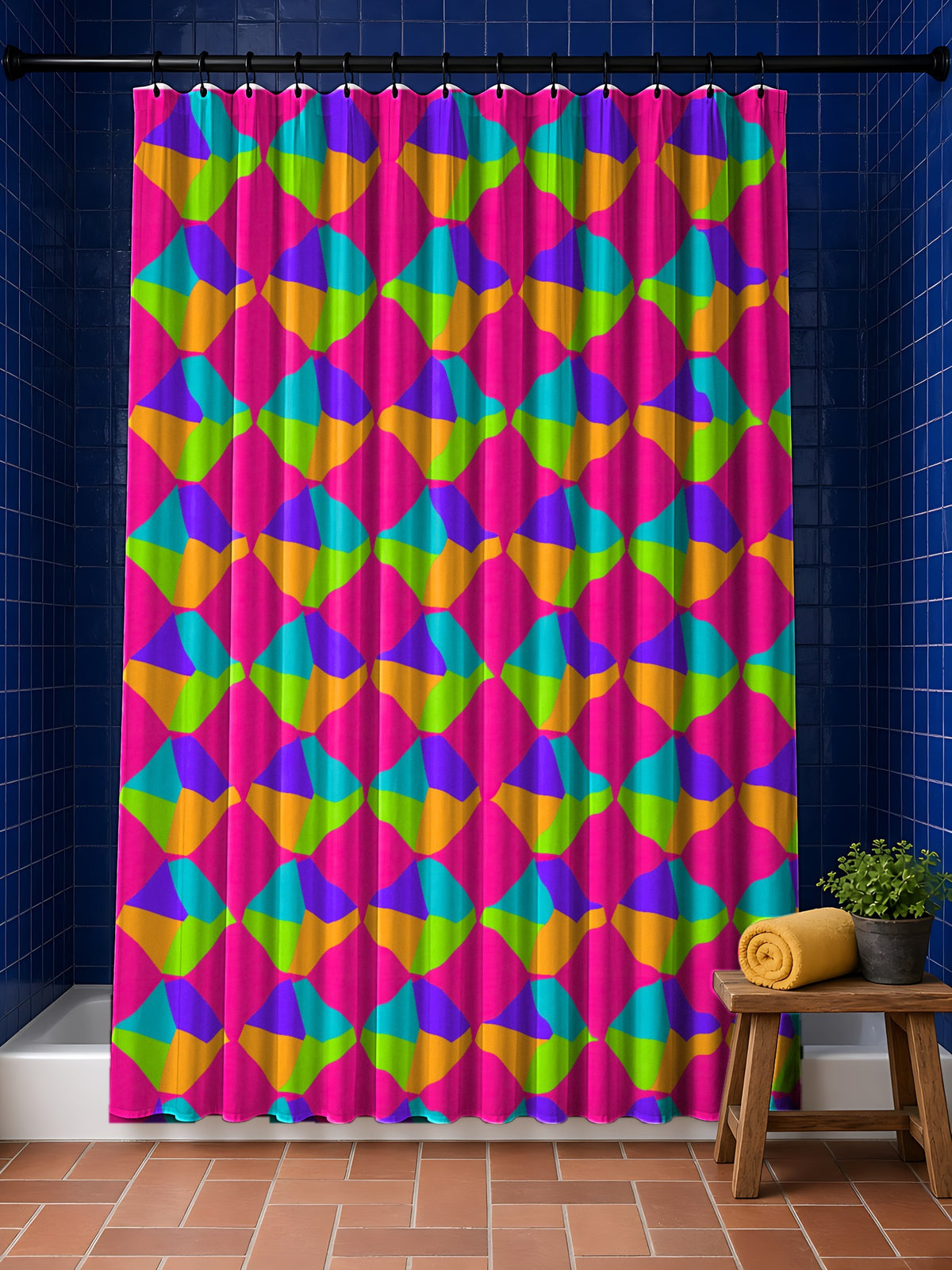 Grand Fractured Rhombus Shower Curtain in the Tropical Punch palette, hanging in a bathroom with cobalt tiles and a terracotta floor