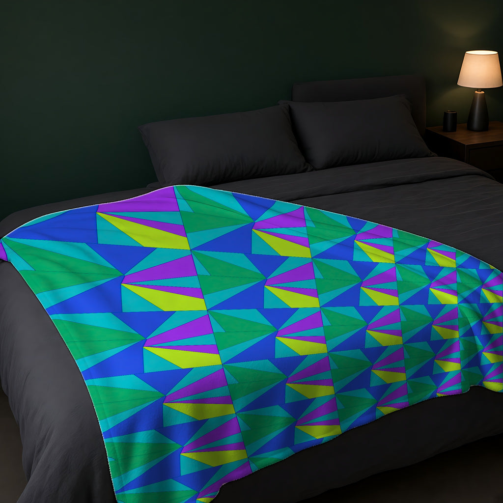 Cubist Sunburst Blocks Sherpa Fleece Blanket across the foot of a dark bed