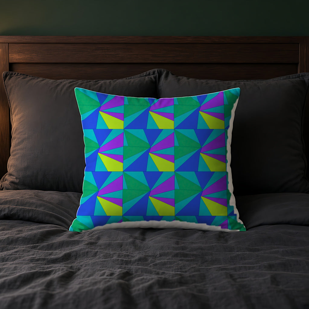 Cubist Sunburst Blocks Faux Suede Cushion on a bed with charcoal bedding