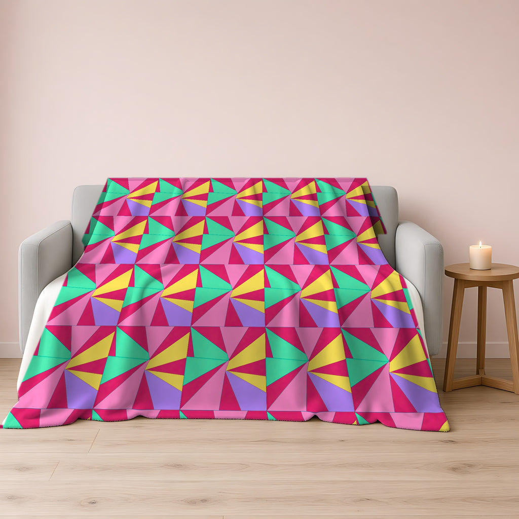 Cubist Sunburst Blocks Sherpa Fleece Blanket draped over a grey sofa