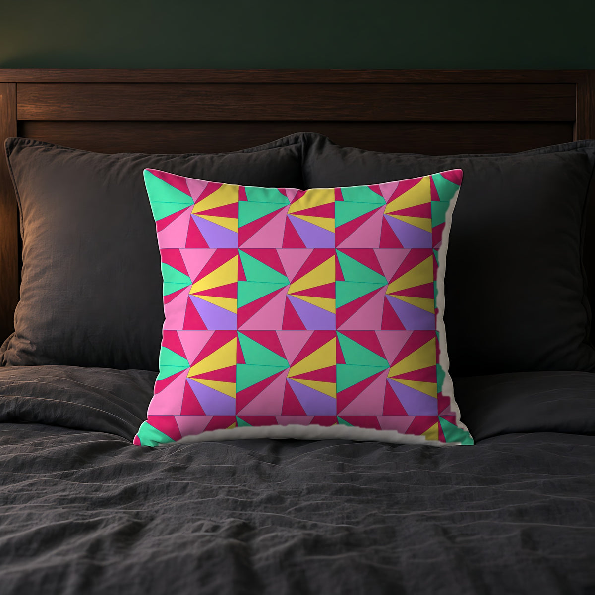 Cubist Sunburst Blocks Faux Suede Cushion on a bed with charcoal bedding