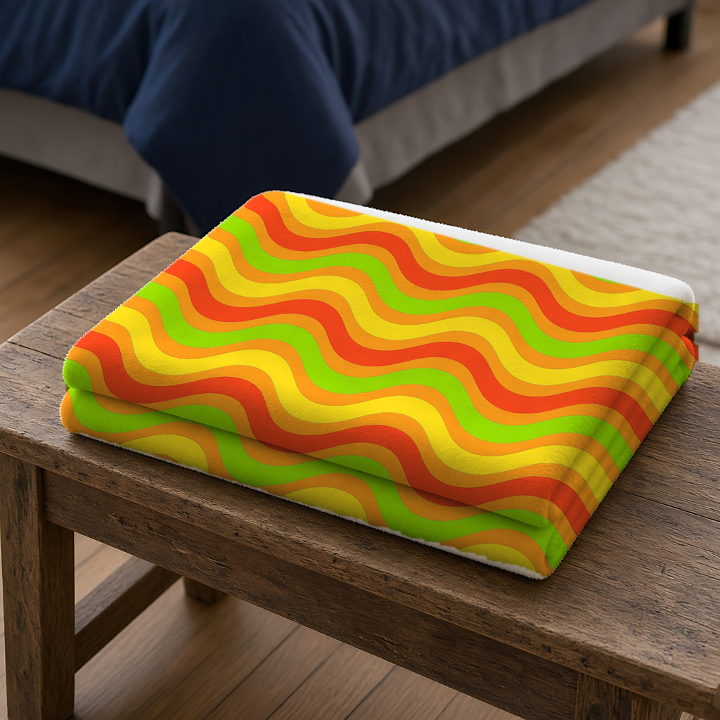 Wide Wave Interference Sherpa Fleece Blanket folded on a wooden bench