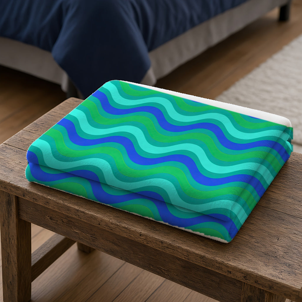 Wide Wave Interference Sherpa Fleece Blanket folded on a wooden bench