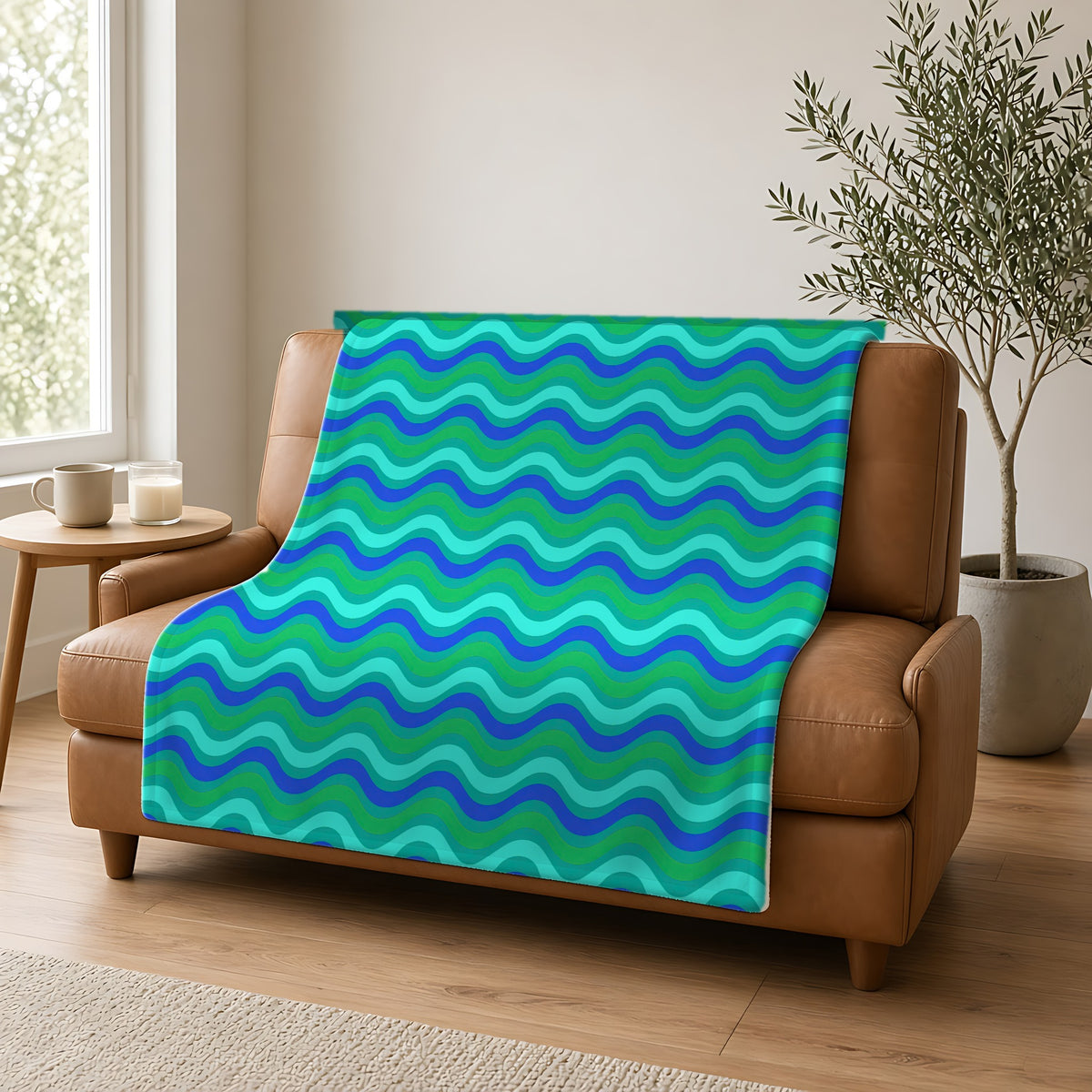 Wide Wave Interference Sherpa Fleece Blanket draped over a caramel leather sofa