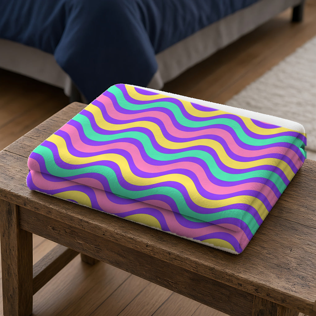 Wide Wave Interference Sherpa Fleece Blanket folded on a wooden bench