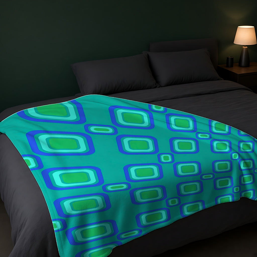 Big Ripple Squares Sherpa Fleece Blanket across the foot of a dark bed