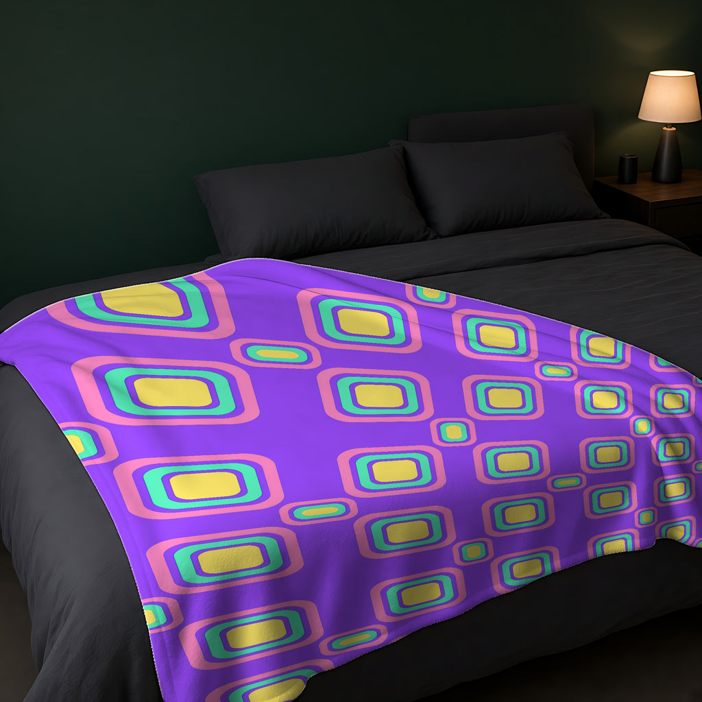 Big Ripple Squares Sherpa Fleece Blanket across the foot of a dark bed