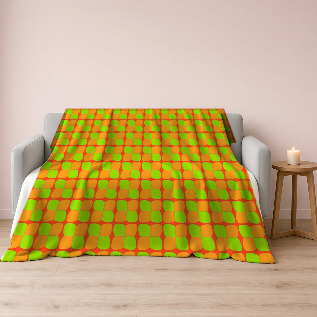 Bold Bulge Checker Sherpa Fleece Blanket draped over a grey sofa