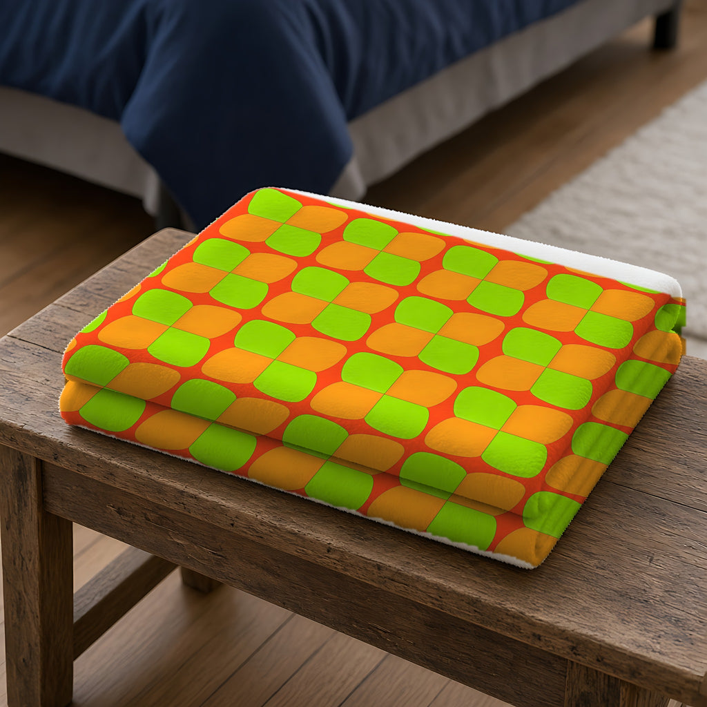 Bold Bulge Checker Sherpa Fleece Blanket folded on a wooden bench