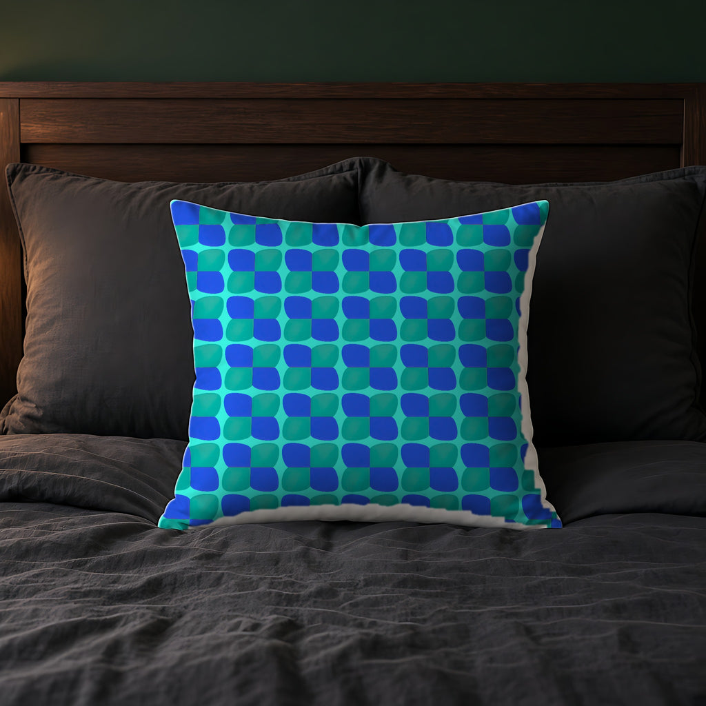 Bold Bulge Checker Faux Suede Cushion on a bed with charcoal bedding
