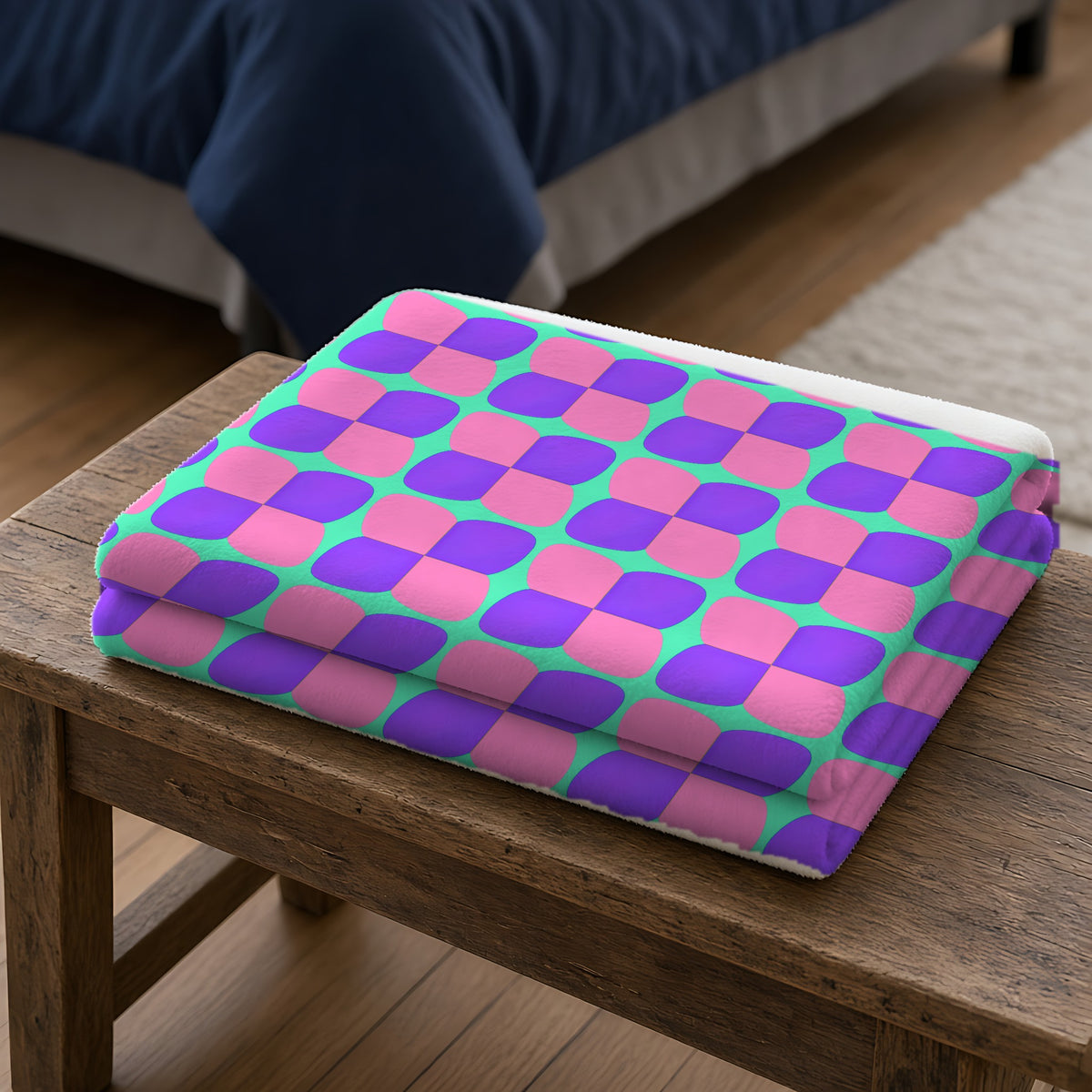 Bold Bulge Checker Sherpa Fleece Blanket folded on a wooden bench