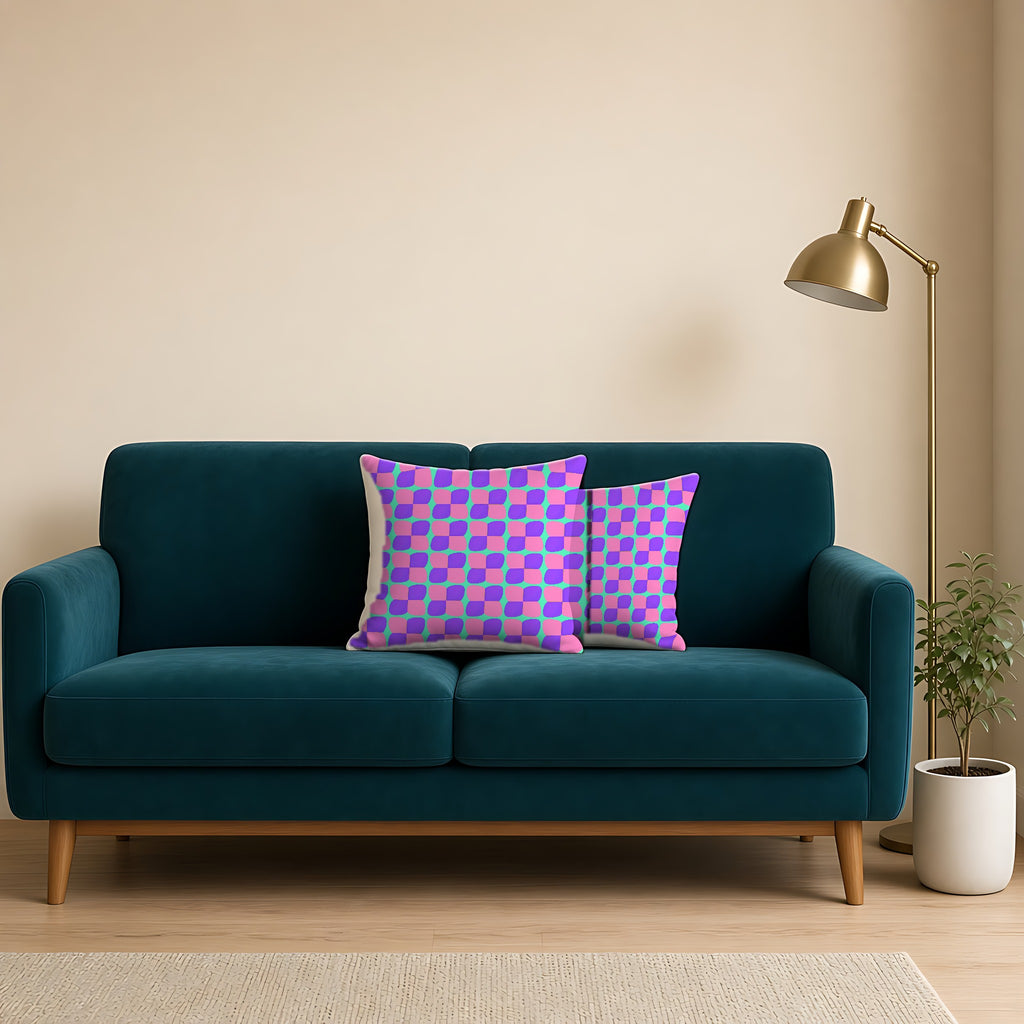 Bold Bulge Checker Faux Suede Cushion on a teal velvet sofa
