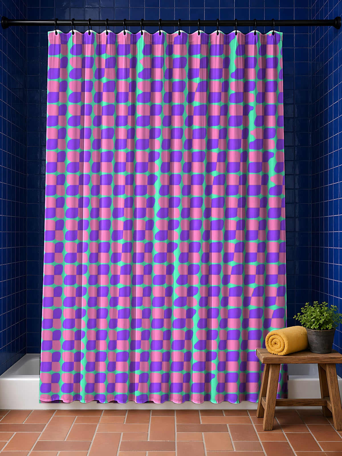 Bold Bulge Checker Shower Curtain in the Candy Pastel on Grape palette, hanging in a bathroom with cobalt tiles and a terracotta floor