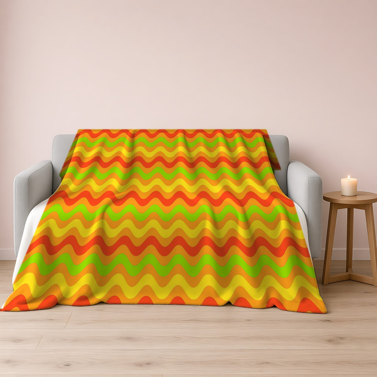 Big Ripple Chevrons Sherpa Fleece Blanket draped over a grey sofa