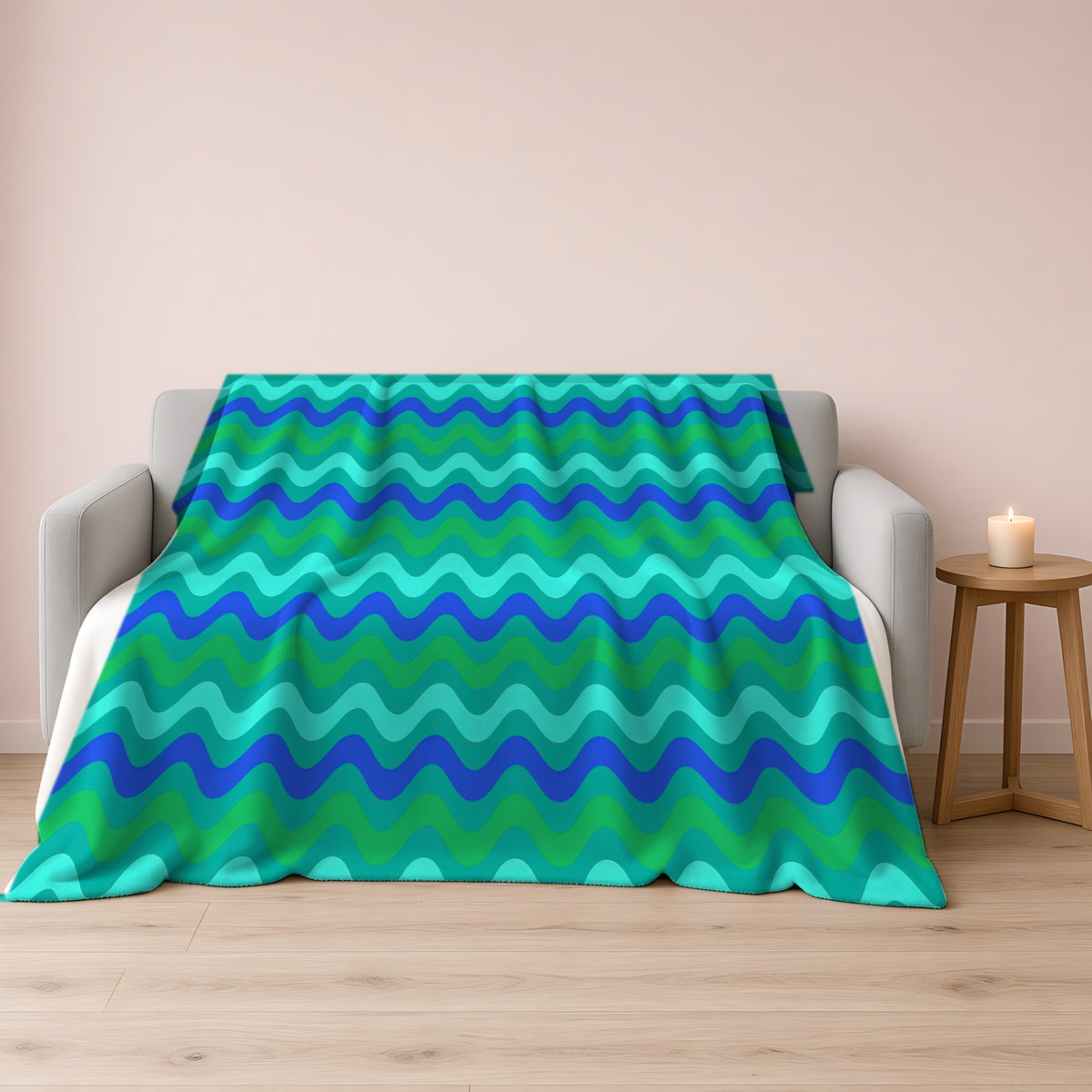 Big Ripple Chevrons Sherpa Fleece Blanket draped over a grey sofa