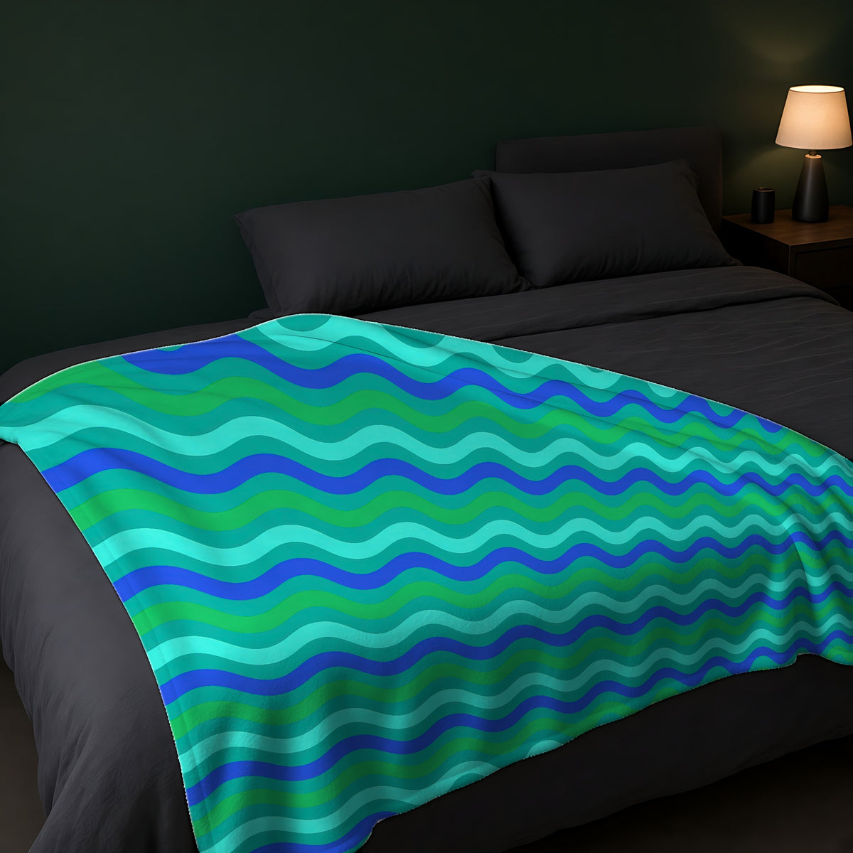 Big Ripple Chevrons Sherpa Fleece Blanket across the foot of a dark bed