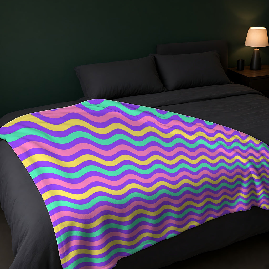 Big Ripple Chevrons Sherpa Fleece Blanket across the foot of a dark bed