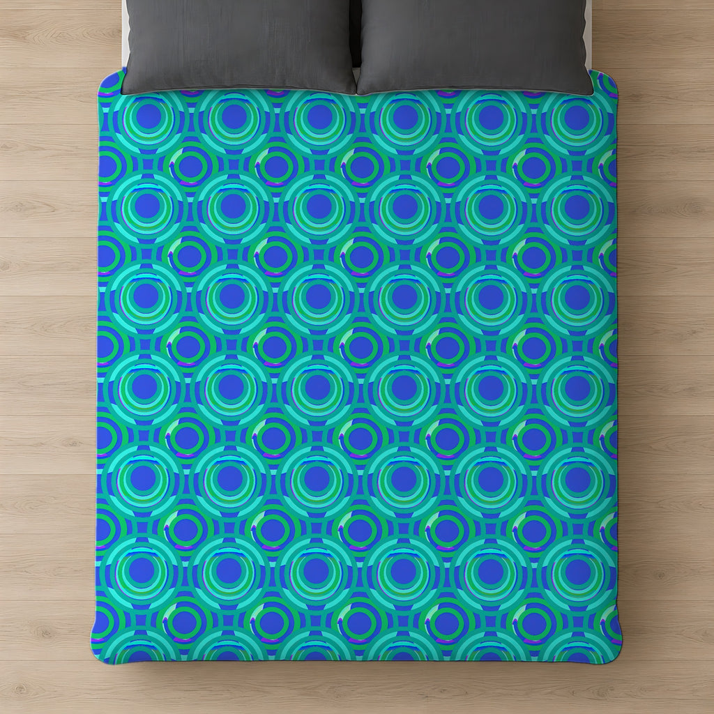 Interlocking Ring Ripples Comforter on a bed, seen from above