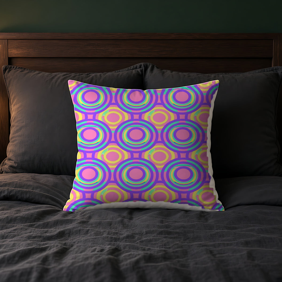 Interlocking Ring Ripples Faux Suede Cushion on a bed with charcoal bedding