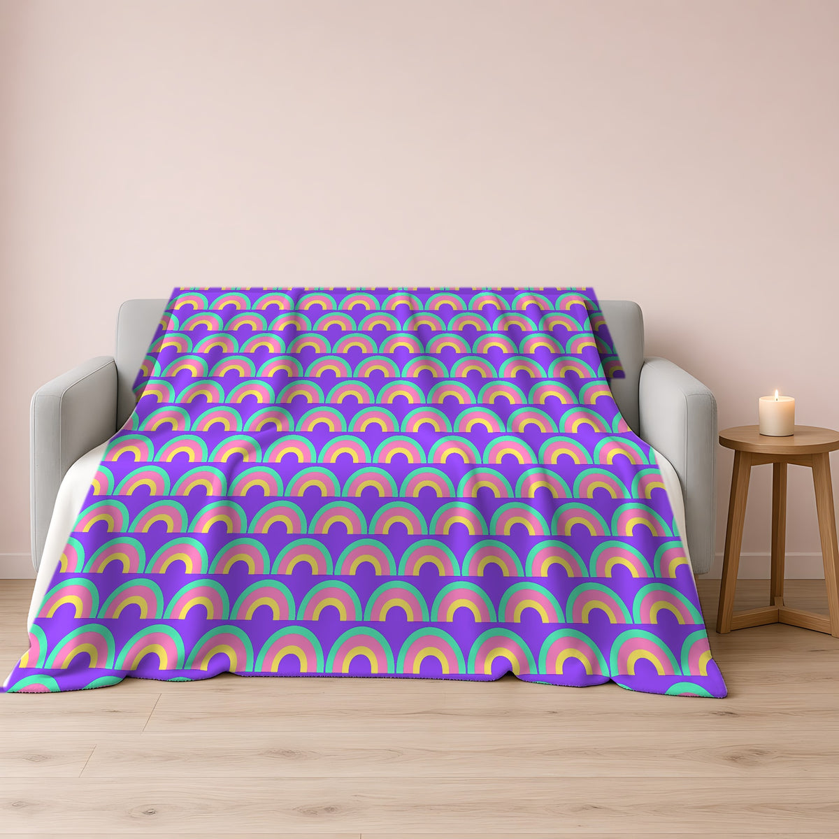 Chromatic Scallop Ripple Sherpa Fleece Blanket draped over a grey sofa