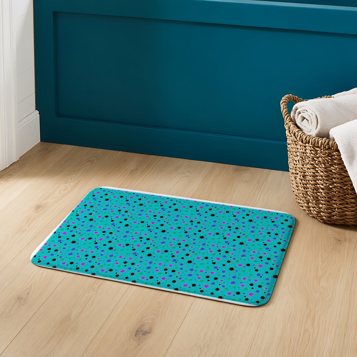 Splat Storm Bath Mat on an oak floor in a teal bathroom
