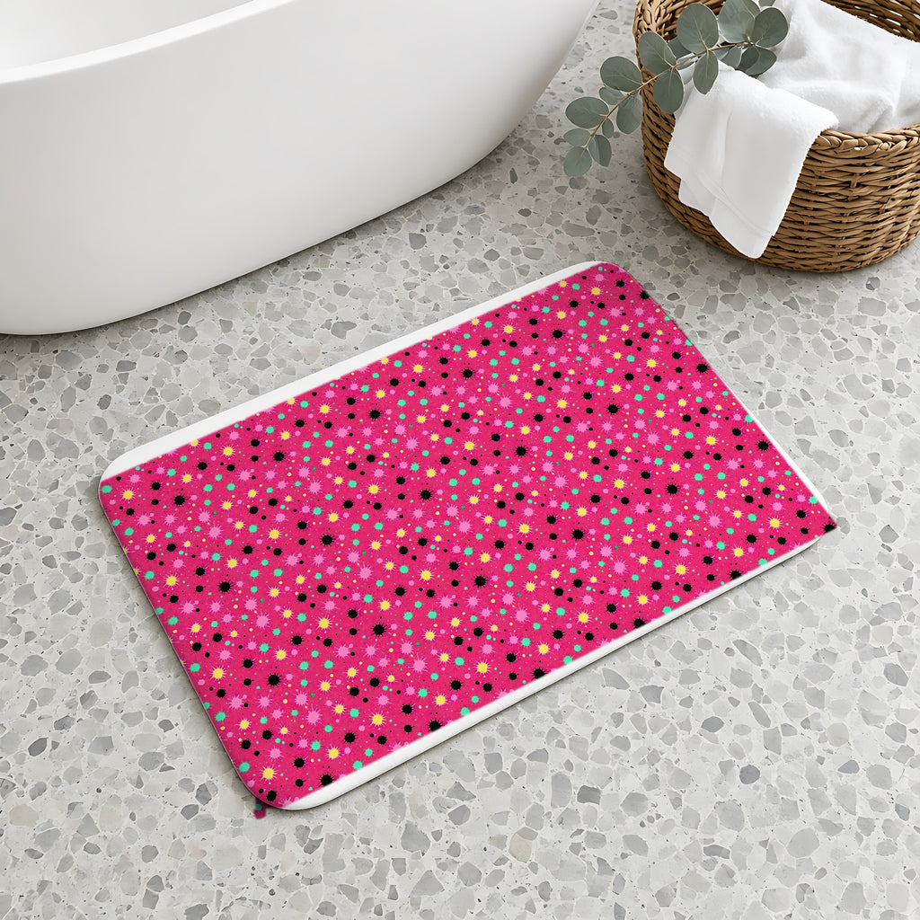 Splat Storm Bath Mat on a terrazzo floor beside a freestanding bath