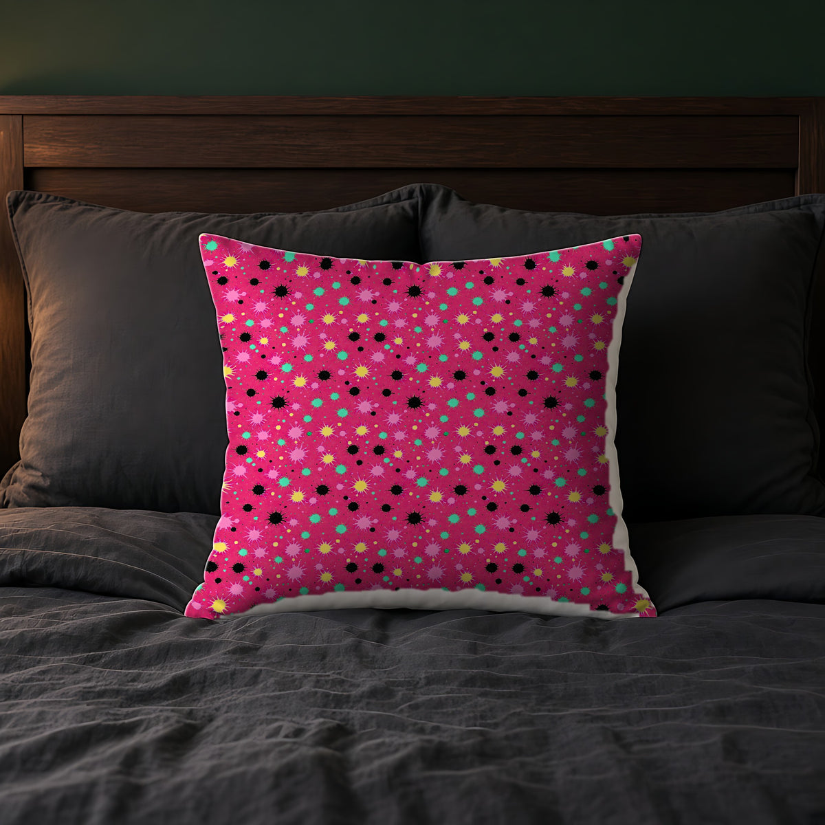 Splat Storm Faux Suede Cushion on a bed with charcoal bedding
