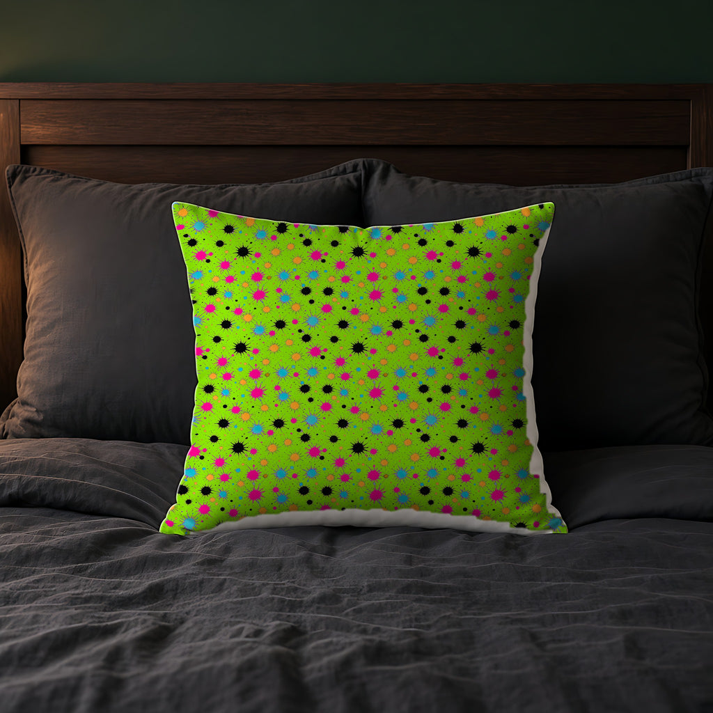 Splat Storm Faux Suede Cushion on a bed with charcoal bedding