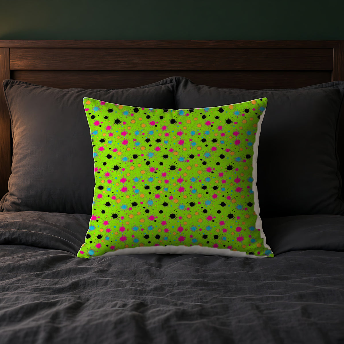 Splat Storm Faux Suede Cushion on a bed with charcoal bedding