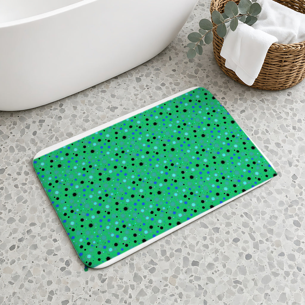 Splat Storm Bath Mat on a terrazzo floor beside a freestanding bath