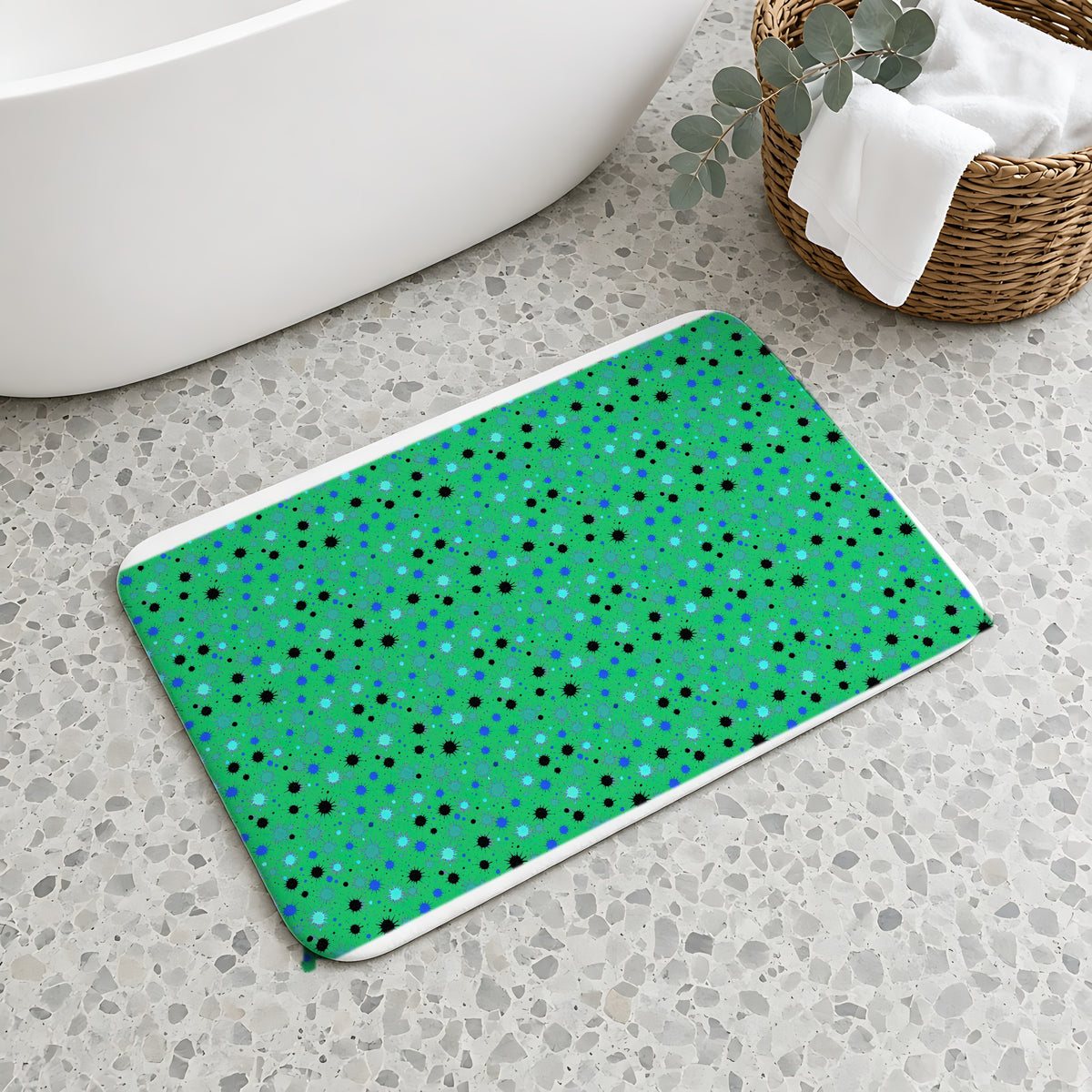 Splat Storm Bath Mat on a terrazzo floor beside a freestanding bath
