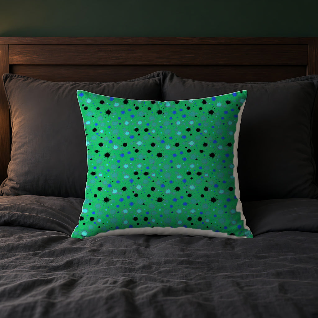 Splat Storm Faux Suede Cushion on a bed with charcoal bedding